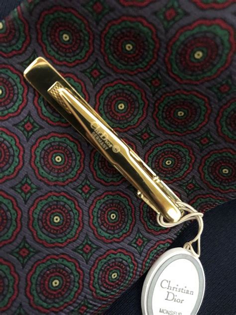 dior tie bar